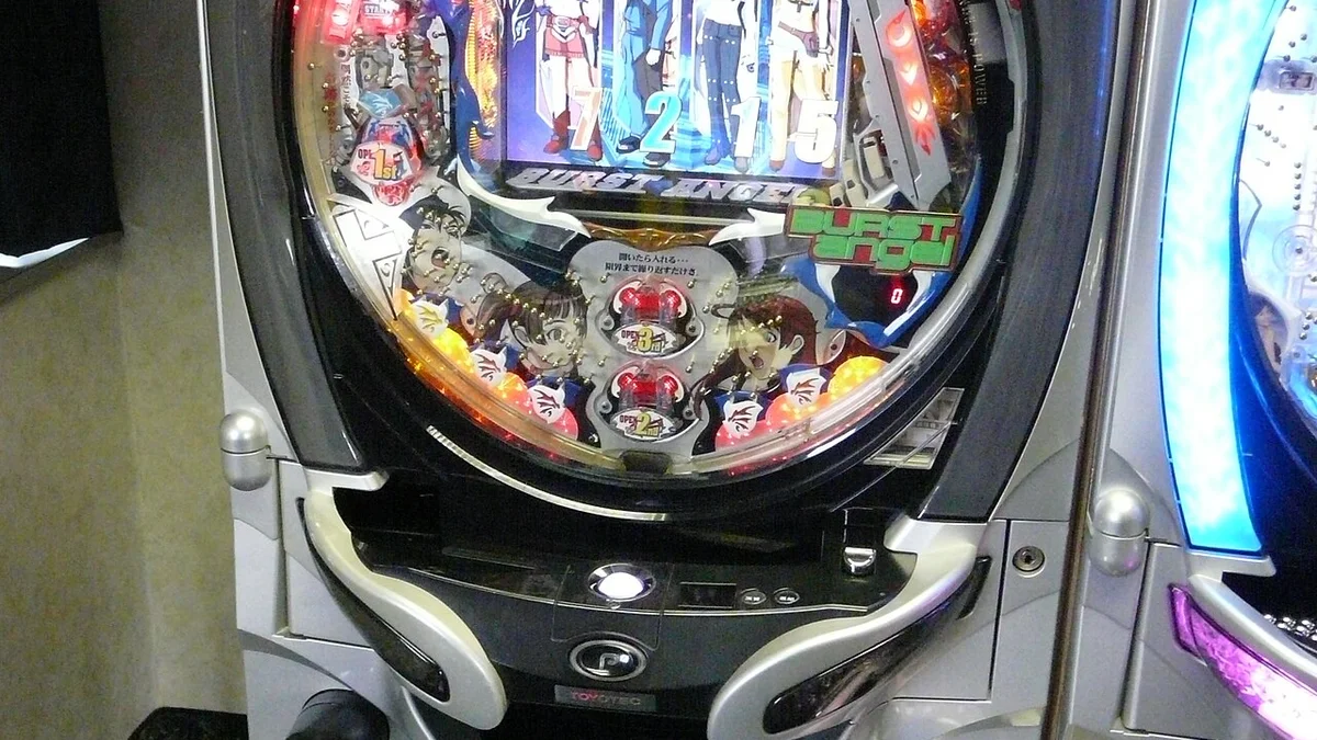 Modern pachinko machine with electronic ball counter tray showing accumulated prize balls